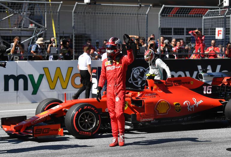 Ferrari's Monegasque driver Charles Leclerc celebrates after the qualifying session of the Austrian Formula One Grand Prix in Spielberg on June 29, 2019. - Ferrari's Charles Leclerc shut out Lewis Hamilton to take pole for the Austrian Grand Prix with a new lap record in final qualifying on Saturday. (Photo by Andrej ISAKOVIC / AFP)