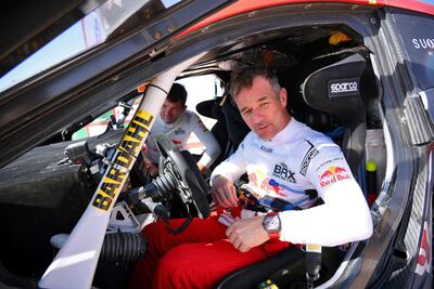 French driver Sebastien Loeb reacts the end of the Stage 8 of the Dakar Rally 2022 between al-Dawadimi and Wadi Ad-Dawasir in Saudi Arabia, on January 10, 2022. - France's nine-time world rally champion Sebastien Loeb made inroads into overall Dakar leader Nasser al-Attiyah's advantage after finishing third in Monday's 395 kilometres special stage from al-Dawadimi to Wadi Ad Dawasir. (Photo by FRANCK FIFE / AFP)