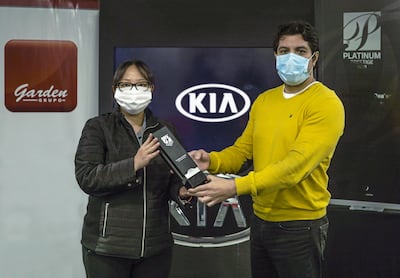 Diana Han, gerente de posventa de Kia Paraguay, y Didier Arias, CEO del Grupo Garden.