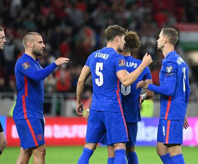 England's team celebrates after the FIFA World Cup Qatar 2022 qualification Group I football match between Hungary and England, at the Puskas Arena in Budapest on September 2, 2021. (Photo by Attila KISBENEDEK / AFP)