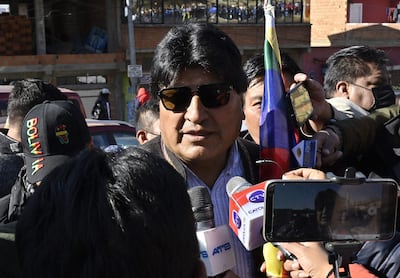 Bolivian former President Evo Morales speaks to members of the media as he participates in a march down from El Alto to La Paz in support of President Luis Arce's government on August 25, 2022. (Photo by AIZAR RALDES / AFP)