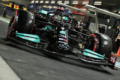 Mercedes' British driver Lewis Hamilton drives in the pit lane during the second practice session of the Saudi Arabian Grand Prix at the Jeddah Corniche Circuit in Jeddah on December 3, 2021. (Photo by ANDREJ ISAKOVIC / AFP)