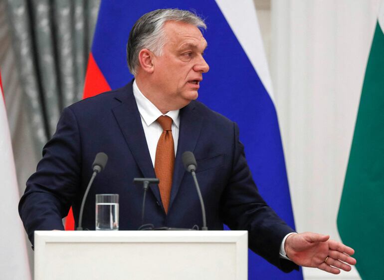 Hungarian Prime Minister Viktor Orban gestures as he gives a press conference with Russian President after their meeting at the Kremlin in the Moscow on February 1, 2022. (Photo by YURI KOCHETKOV / POOL / AFP)