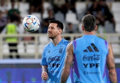 Argentina's forward Lionel Messi (L) controls a ball during a training camp in Abu Dhabi ahead of the Qatar 2022 FIFA football World Cup, at the Nahyan Stadium, on November 14, 2022. (Photo by Karim SAHIB / AFP)