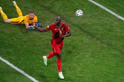 TOPSHOT - Belgium's forward Romelu Lukaku (R) celebrates after scoring, before the VAR ruled the goal for offside, during the UEFA EURO 2020 Group B football match between Finland and Belgium at Saint Petersburg Stadium in Saint Petersburg, Russia, on June 21, 2021. (Photo by ANTON VAGANOV / POOL / AFP)