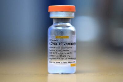(FILES) In this file photo taken on February 25, 2021 shows a vial of the Sinovac vaccine against COVID-19, in Cali, Colombia. - The World Health Organization on June 1, 2021 approved the Sinovac Covid-19 vaccine for emergency use -- the second Chinese jab to receive the WHO's green light. (Photo by Luis ROBAYO / AFP)