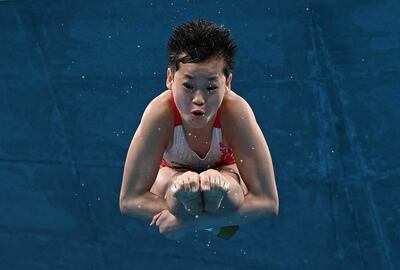 Hongchan Quan, con 14 años, de China, en final de clavados, fue oro. (Photo by Attila KISBENEDEK / AFP)