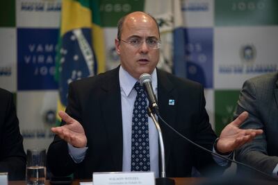 (FILES) In this file photo taken on September 23, 2019 Rio de Janeiro's Governor Wilson Witzel gestures during a press conference in Rio de Janeiro, Brazil, after eight-year-old Agatha Sales Felix died during a police operation at the Alemao complex slum. - Massive amounts of government emergency funds to fight the pandemic say are being stolen in the world's second-hardest-hit country, experts saym as the rush to respond to COVID-19 is sideswiped by an older, endemic disease: corruption. Brazil has a long history of graft scandals. But even by Brazilian standards, the scope of the accusations is outrageous. Even football superstar Neymar got dragged in. His name and personal data were used to register for the 600-real monthly stimulus payments the federal government is paying poor Brazilians hit hard by lockdown measures. (Photo by MAURO PIMENTEL / AFP)