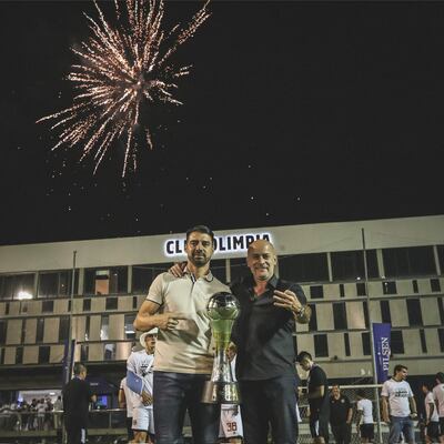 El DT  Julio César Cáceres López (42 años), con el presidente Miguel Ángel  Cardona Herreros (54).
