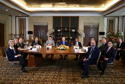 US President Joe Biden (C) and other G7 leaders gather to hold an "emergency" meeting to discuss a missile strike on Polish territory near the border with Ukraine, on the side line of the G20 leaders' summit in Nusa Dua, on the Indonesian resort island of Bali on November 16, 2022. (Photo by SAUL LOEB / AFP)