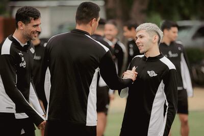 Julio Enciso Espínola, con los consagrados Óscar Cardozo y Roque Santa Cruz, durante su despedida de la plantilla liberteña.
