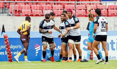 Renato Cardona (ovalada) celebra junto con sus compañeros un try ante Cafeteros. Foto: SLAR