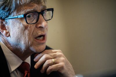 (FILES) In this file photo taken on October 9, 2019 US Microsoft founder, Co-Chairman of the Bill & Melinda Gates Foundation, Bill Gates, takes part in a conference call in Lyon, central eastern France, during the funding conference of Global Fund to Fight AIDS, Tuberculosis and Malaria. - Billionaire philanthropist Bill Gates on July 23 pushed back against some of the conspiracy theories spreading online accusing him of creating the coronavirus outbreak. (Photo by JEFF PACHOUD / AFP)