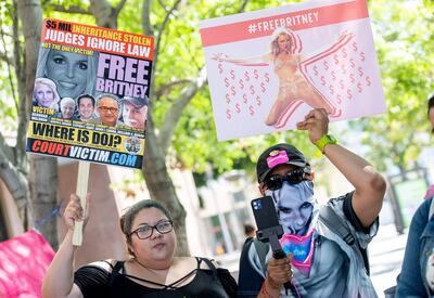 Fans and supporters of Britney Spears hold "Free Britney" signs as they gather outside the Los Angeles County Courthouse during a scheduled hearing in the Britney Spears guardianship case, in Los Angeles, California, July 19, 2021. - Britney Spears' lawyer is moving "aggressively and expeditiously" to remove her father from the controversial guardianship controlling her affairs, he said Monday.
The attorney updated reporters after a very brief Los Angeles court hearing held to discuss security costs for the singer's professional conservator, who said she has received threats over the globally followed case. "My firm and I are moving aggressively and expeditiously to file a petition to remove Jamie Spears unless he resigns first," said Mathew Rosengart (Photo by VALERIE MACON / AFP)