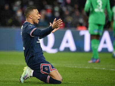 Paris Saint-Germain's French forward Kylian Mbappe reacts during the French L1 football match between Paris-Saint Germain (PSG) and Saint-Etienne (ASSE) at The Parc des Princes Stadium in Paris on February 26, 2022. (Photo by FRANCK FIFE / AFP)