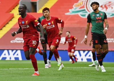 Liverpool (United Kingdom), 05/07/2020.- Sadio Mane of Liverpool (L) celebrates after scoring his team's first goal during the English Premier League soccer match between Liverpool FC and Aston Villa at Anfield stadium in Liverpool, Britain, 05 July 2020. (Reino Unido) EFE/EPA/Paul Ellis/NMC/Pool EDITORIAL USE ONLY. No use with unauthorized audio, video, data, fixture lists, club/league logos or 'live' services. Online in-match use limited to 120 images, no video emulation. No use in betting, games or single club/league/player publications.