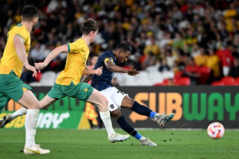 Ecuador's Pervis Estupinan (R) shoots on goal during the football match between Australia and Ecuador at the Docklands Stadium in Melbourne on March 28, 2023. (Photo by William WEST / AFP) / --IMAGE RESTRICTED TO EDITORIAL USE - STRICTLY NO COMMERCIAL USE--