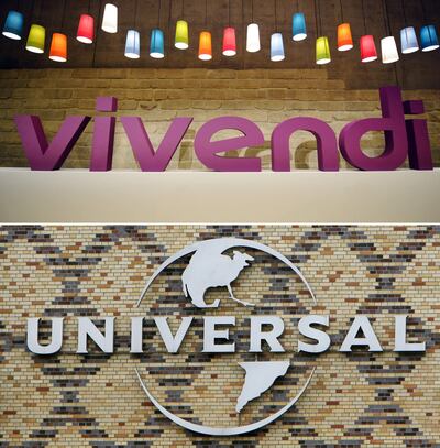 (FILES) This file combination created on July 30, 2018 in Paris, shows the logo of French media group Vivendi in Paris on April 24, 2008 (top) and the logo of music company Universal Music on its headquarters in Berlin on August 23, 2006. - The sale of Universal Music allows Vivendi to be beneficial in 2021. (Photo by Patrick HERTZOG and John MACDOUGALL / AFP)