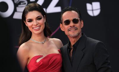 Nadia Ferreira y Marc Anthony llegando a la edición número 23 de los Latin Grammy. (Chris DELMAS / AFP)