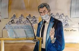 Este boceto de la sala del tribunal realizado el 26 de noviembre de 2020 muestra al ex presidente francés Nicolas Sarkozy durante su juicio por cargos de corrupción, en el juzgado de París.