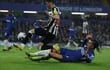 London (United Kingdom), 11/03/2024.- Chelsea's Malo Gusto (down) and Newcastle's Miguel Almiron battle for the ball during the English Premier League soccer match Chelsea FC vs Newcastle United, in London, Britain, 11 March 2024. (Reino Unido, Londres) EFE/EPA/ISABEL INFANTES EDITORIAL USE ONLY. No use with unauthorized audio, video, data, fixture lists, club/league logos, 'live' services or NFTs. Online in-match use limited to 120 images, no video emulation. No use in betting, games or single club/league/player publications.
